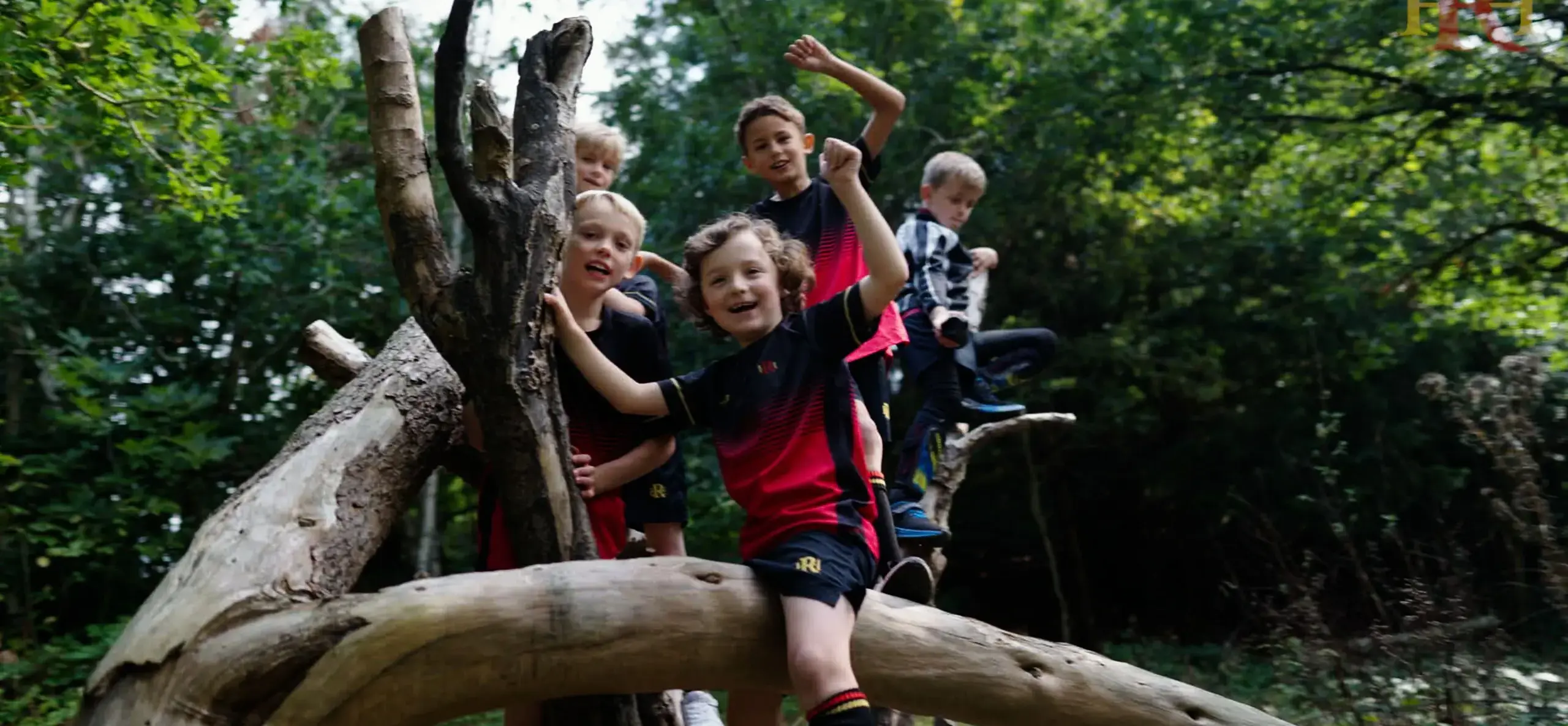 Students posing outdoors at Radnor House Sevenoaks, a private school in Kent