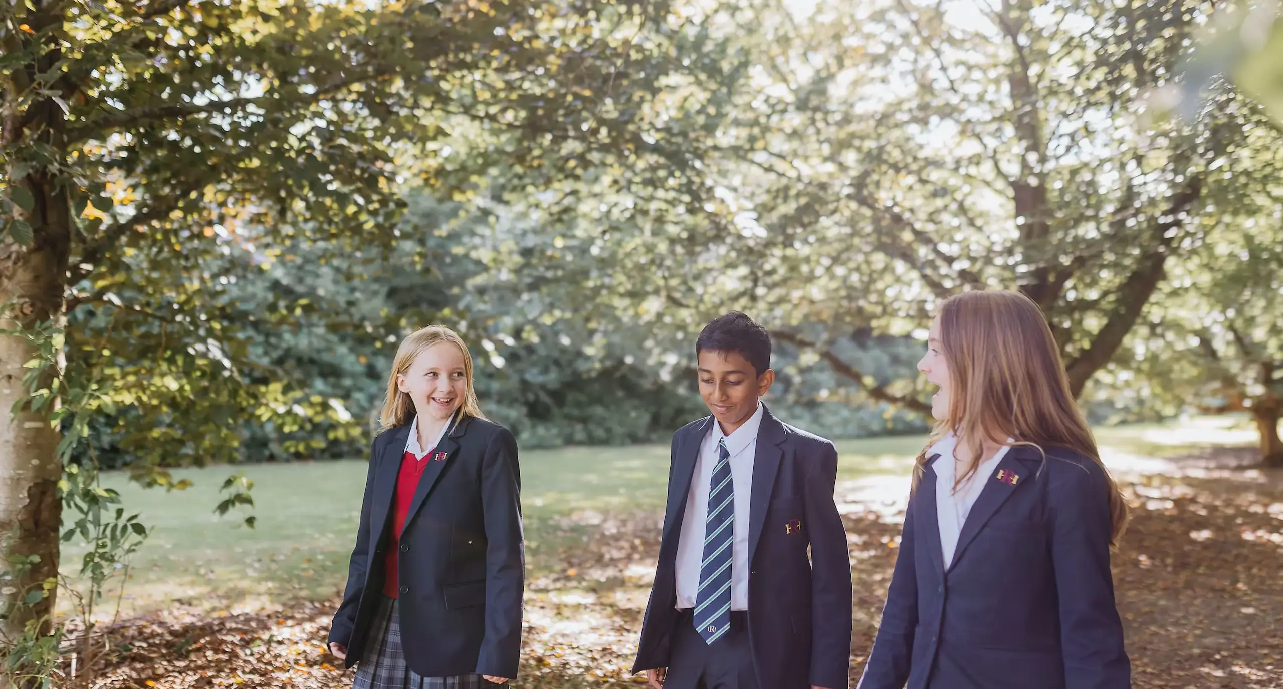 Radnor students walking together through a wooded area