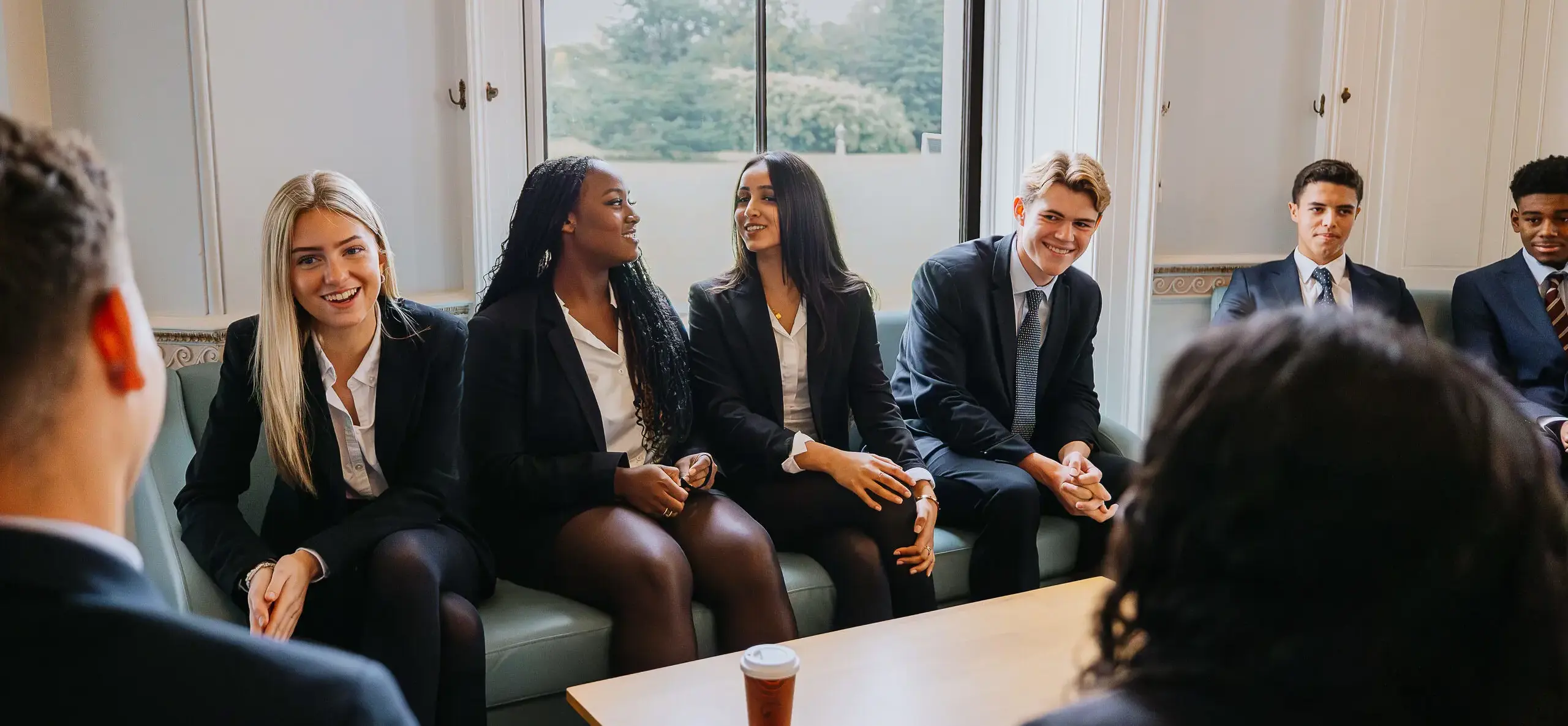 Sixth form students sitting and talking