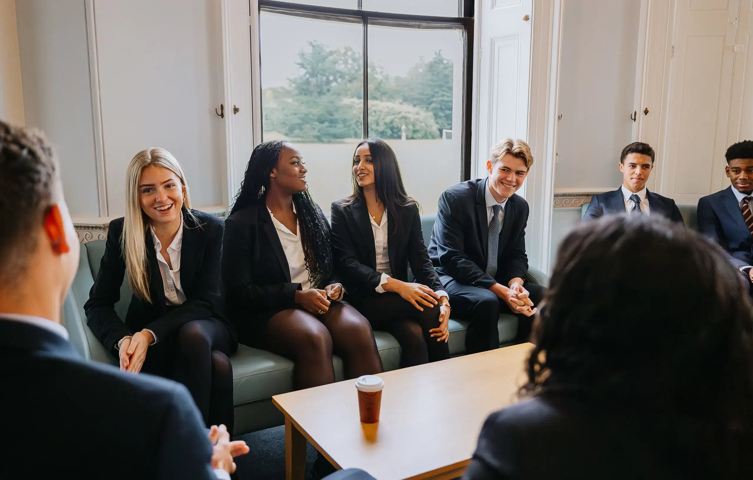 Sixth formers chatting in common room